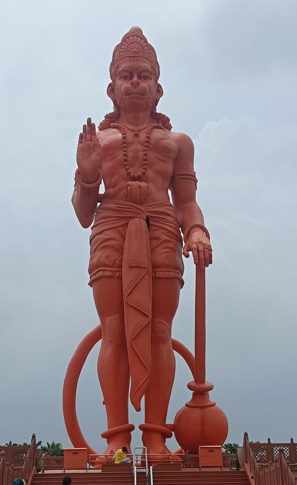 Towering statue of Hanuman against the sky