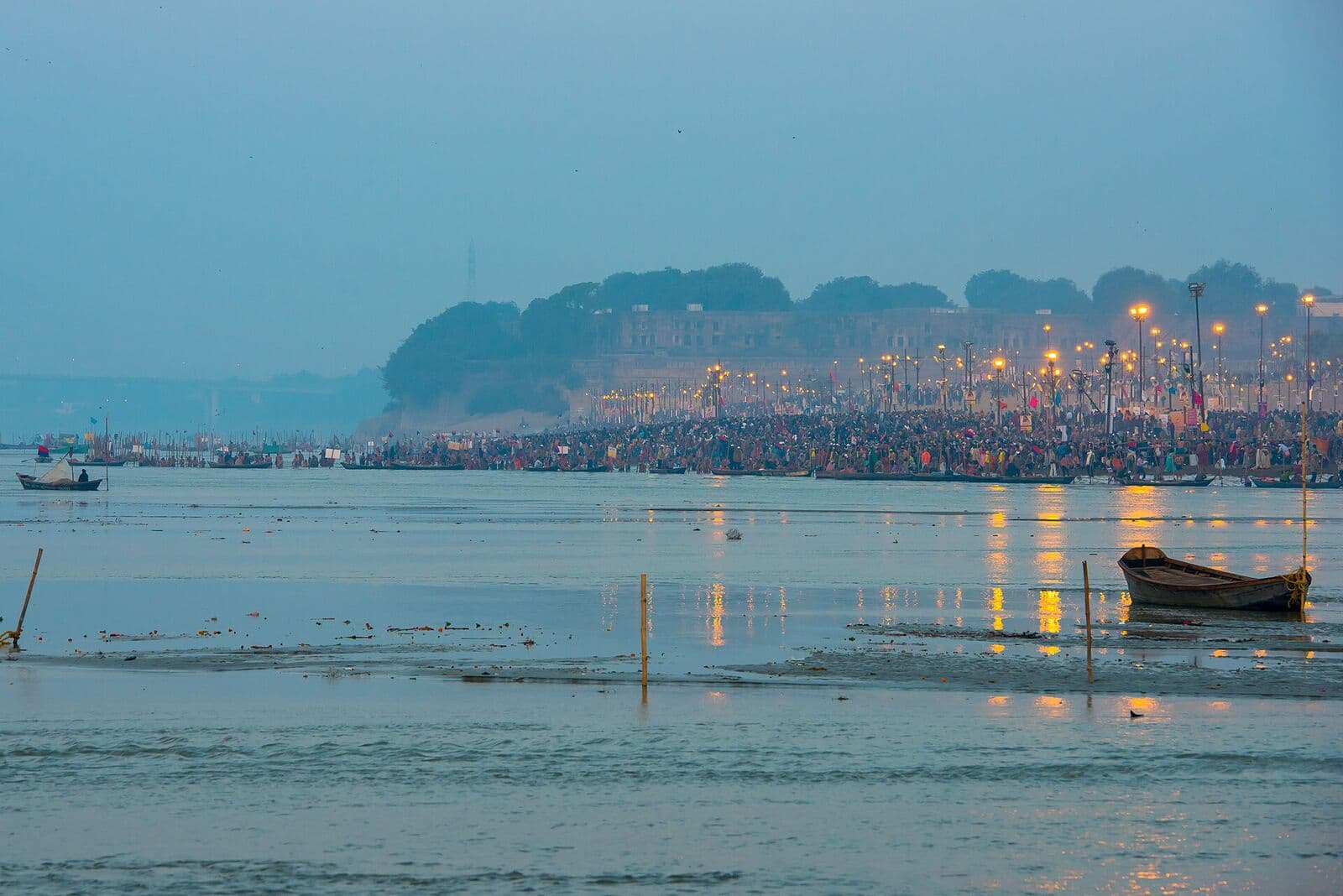 Pilgrims gathered along the river at dawn during the Kumbh Mela, Prayagraj