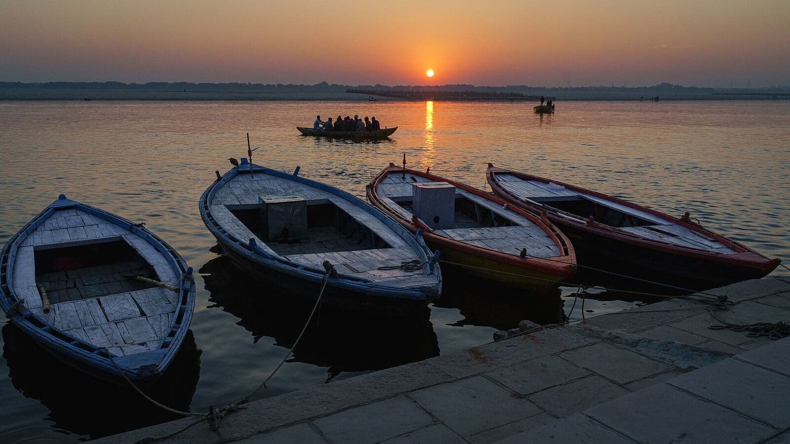 Boats moored on the Ganga at Varanasi as the sun rises