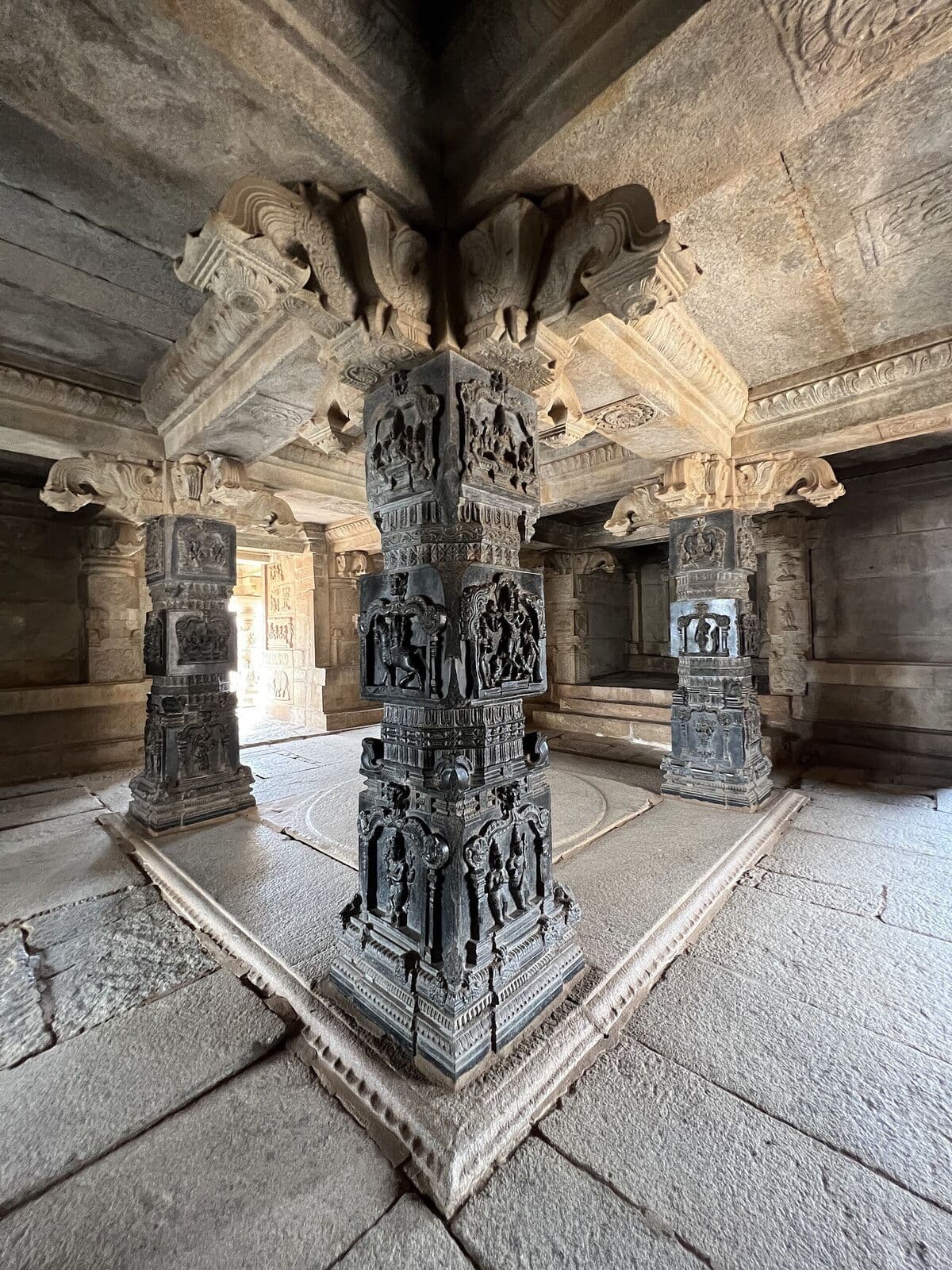 Carved stone pillars of a medieval temple hall at Hampi